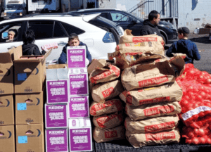 grape juice and potatoes piled up to give away